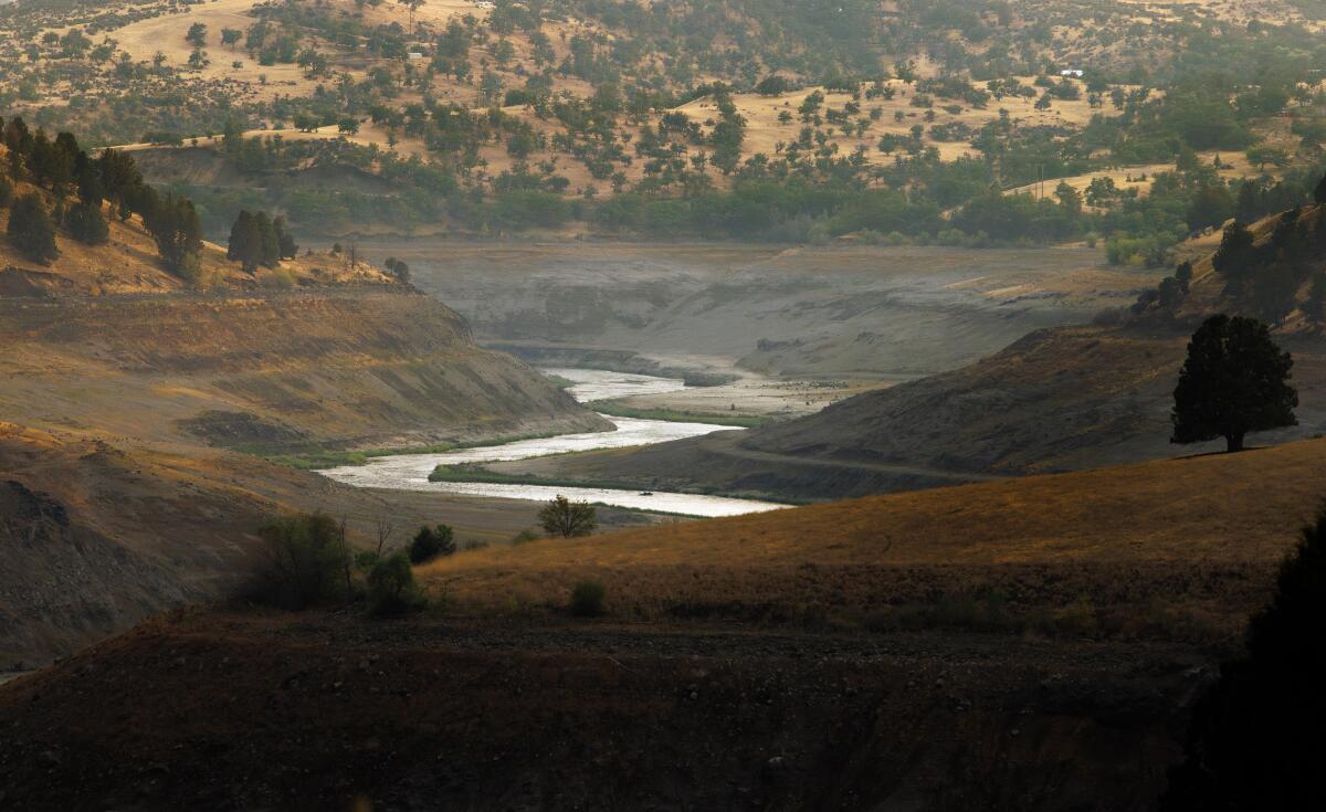 The removal of dams and the draining of reservoirs has enabled the Klamath River to return to its historic channel.