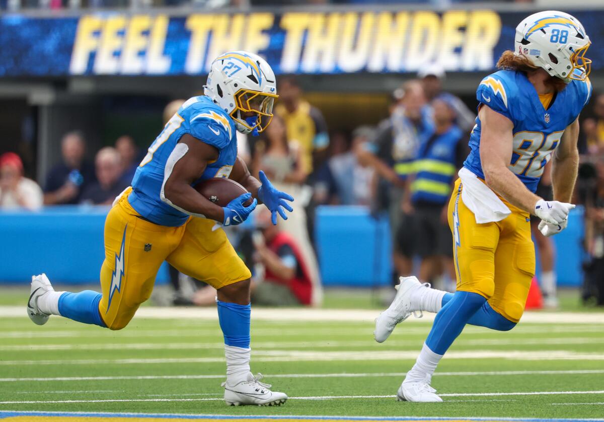 Chargers running back J.K. Dobbins (27) breaks free for a long run against the Las Vegas Raiders.