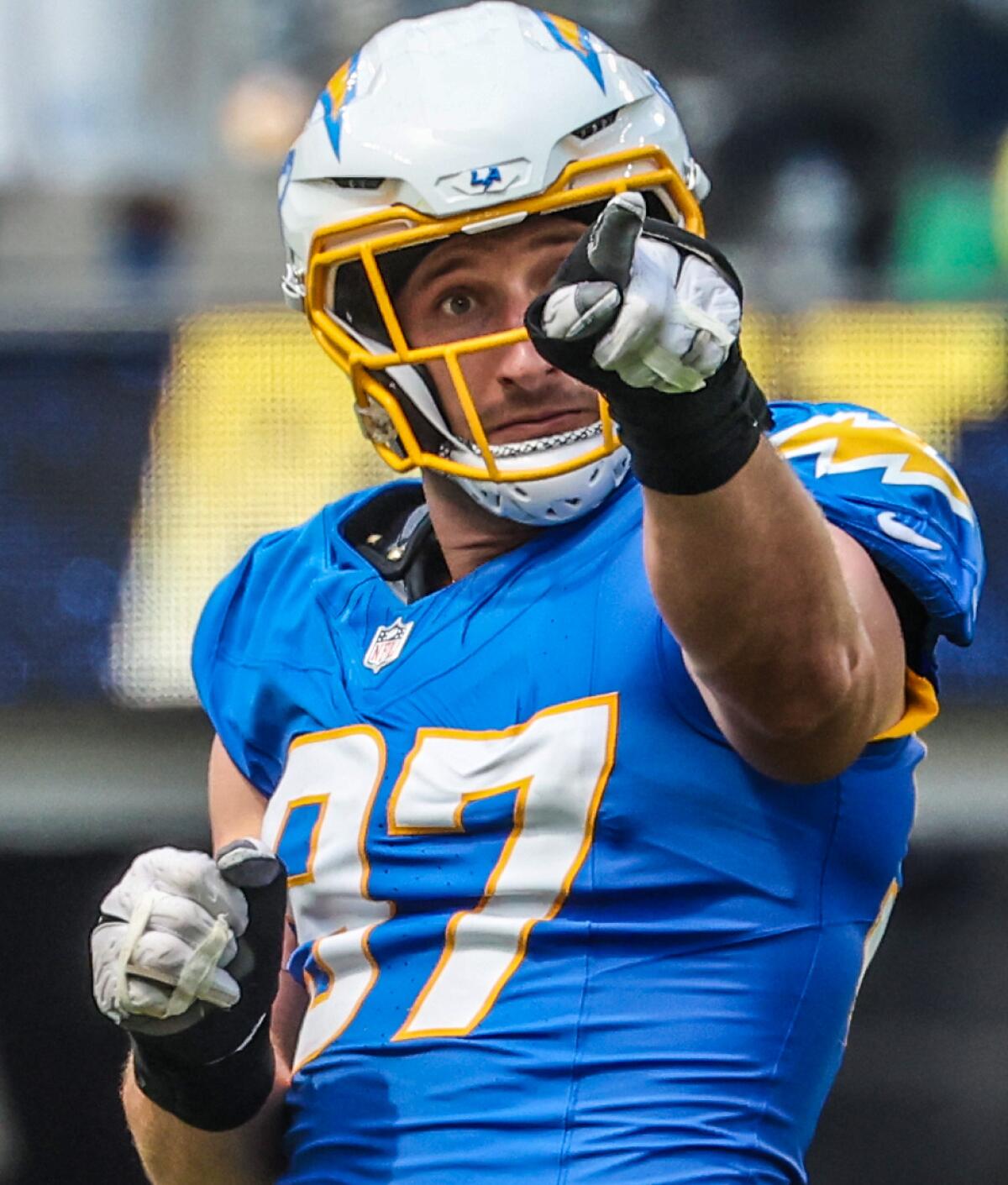 Chargers linebacker Joey Bosa (97) celebrates after sacking  Raiders quarterback Gardner Minshew (15).