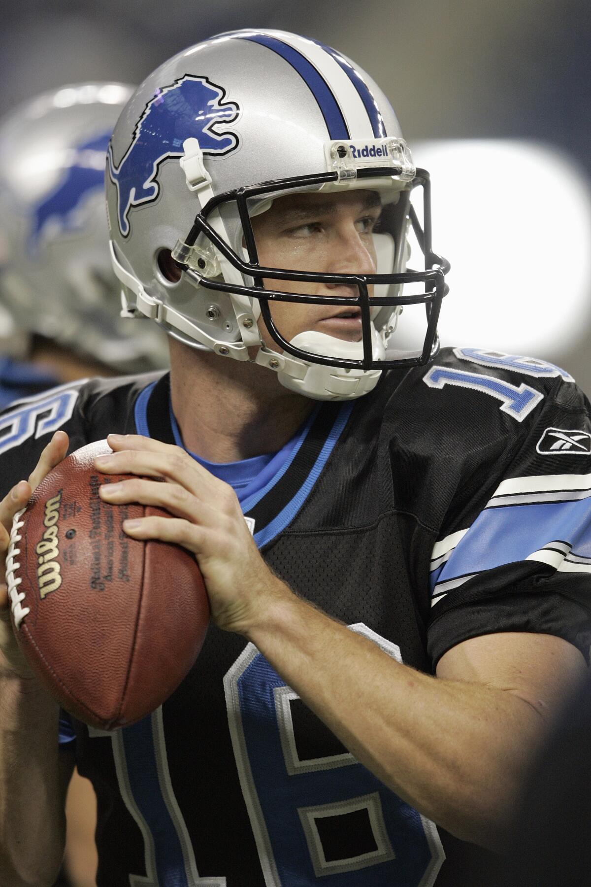 Lions back-up quarterback Todd Mortensen warms up prior to a preseason game.