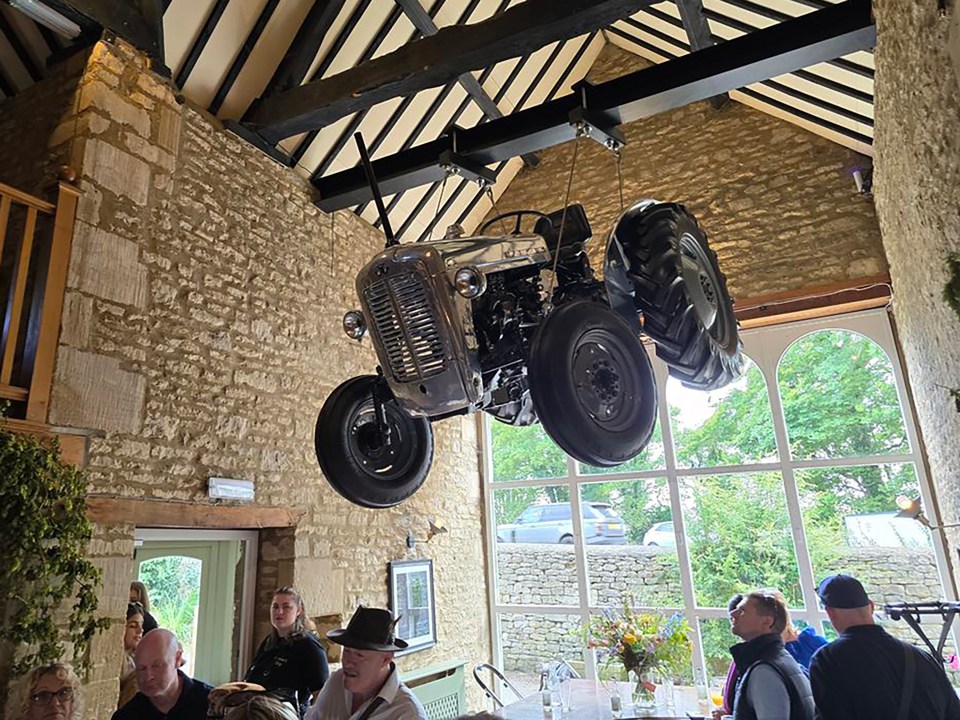 He was forced to spend thousands when he decided to suspend a tractor from the ceiling