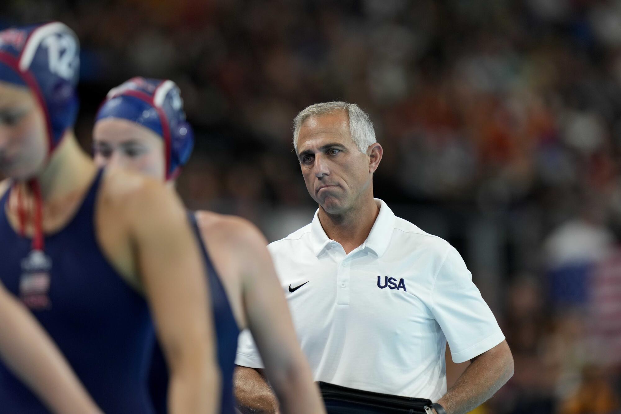 It's unclear if Adam Krikorian walks behind his players during a game at the Paris Olympics.