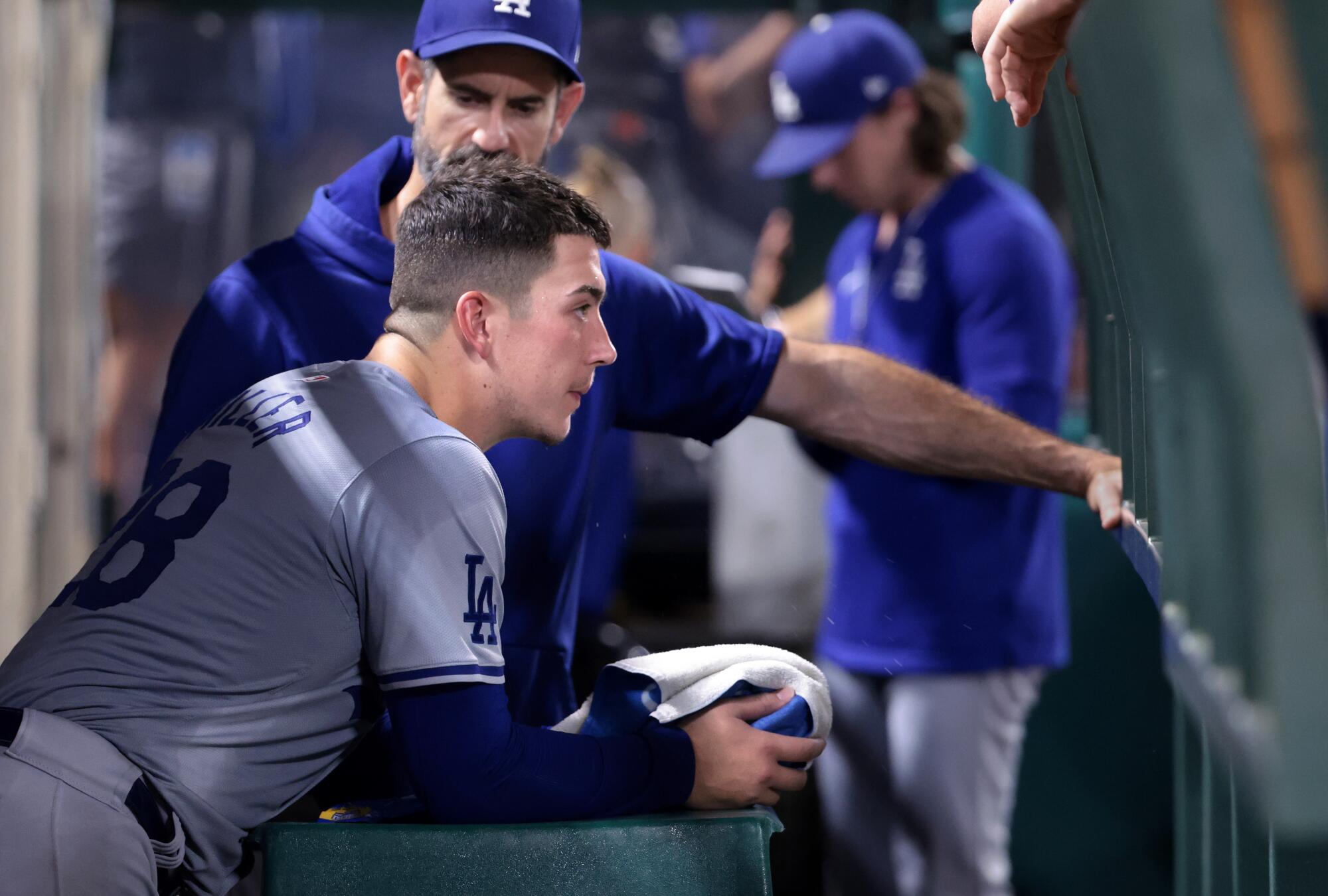 Dodgers pitcher Bobby Miller talks to pitching coach Mark Prior after struggling against the Angels on Sept. 4.