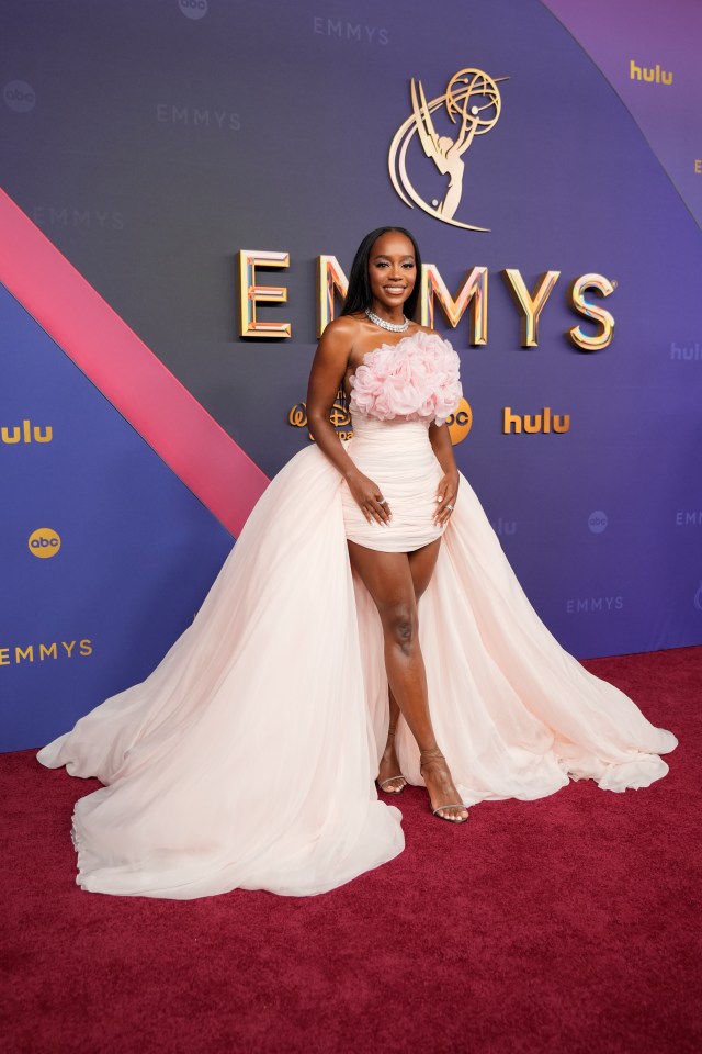 Aja Naomi King arrives at the 76th Primetime Emmy Awards in a beautiful pink dress