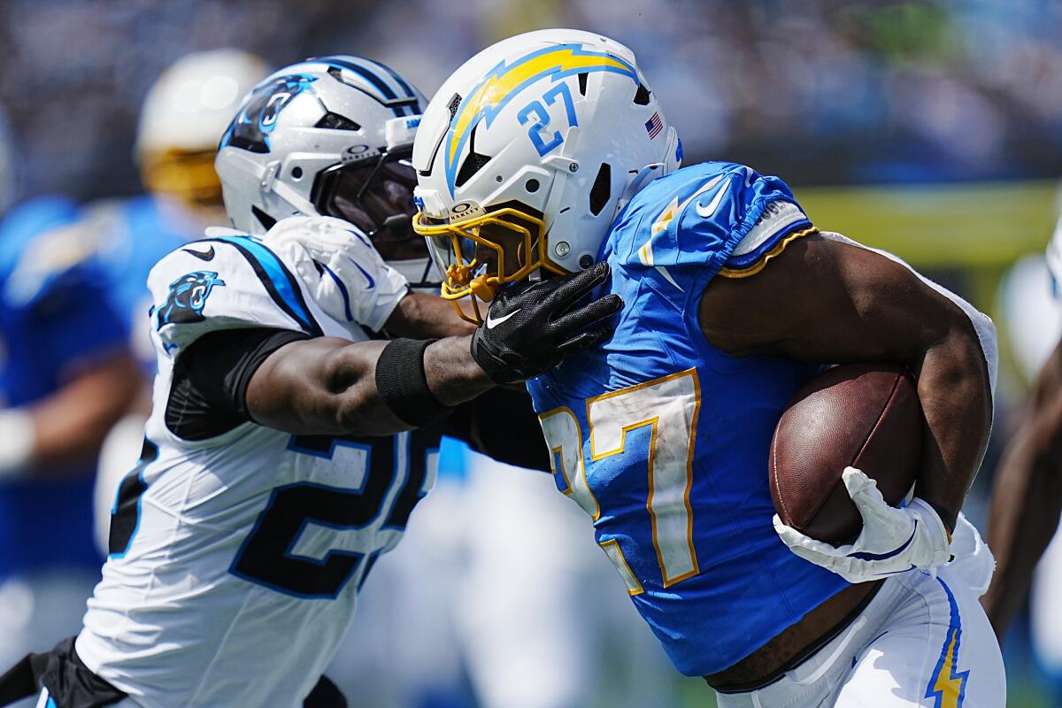 Chargers running back J.K. Dobbins runs past the Panthers defense for a touchdown.