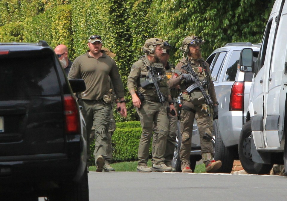 Armed officers outside Diddy's home in Los Angeles