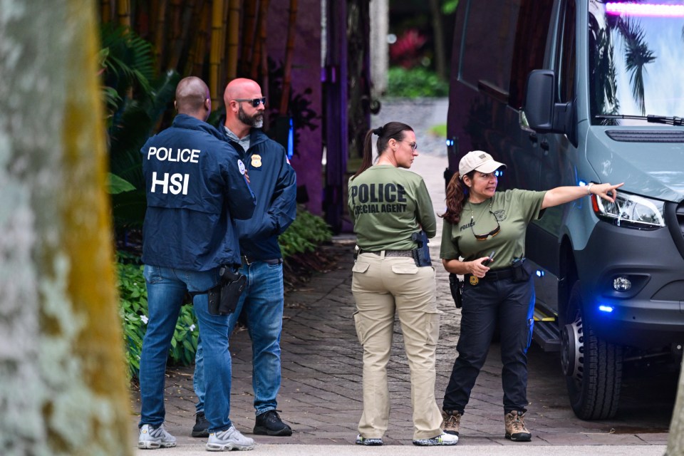 Federal and Homeland Security Investigations agents outside his home in Miami