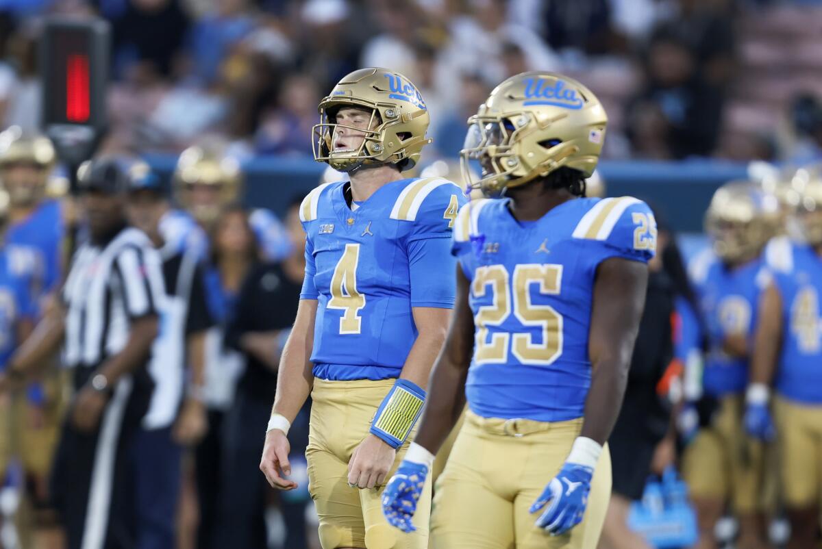 UCLA quarterback Ethan Garbers reacts next to running back T.J. Harden after being sacked by Indiana at the Rose Bowl.