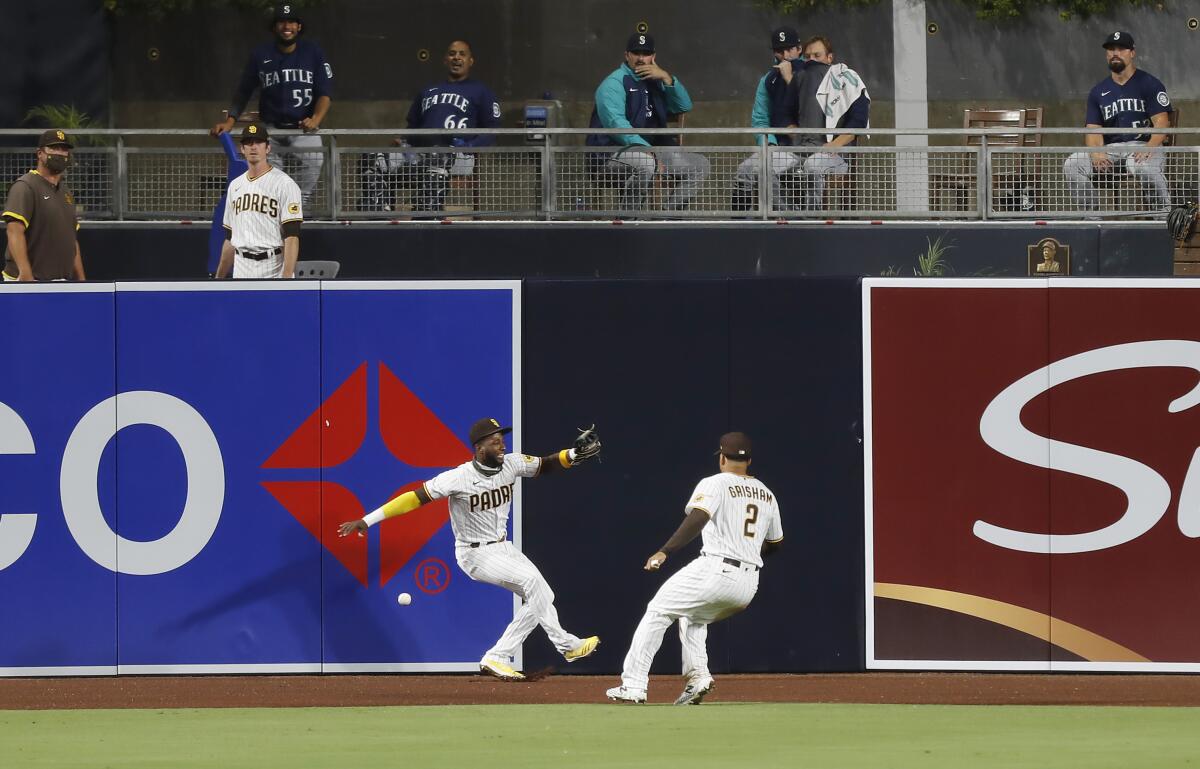 An Arco sign is partially visible on an outfield wall of a baseball stadium.