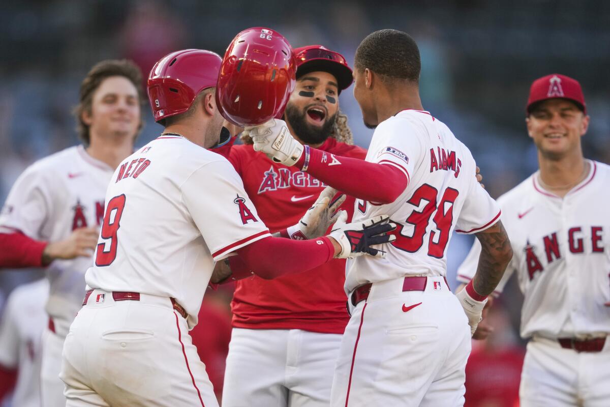 Los Angeles Angels' Jordyn Adams celebrates with teammates.