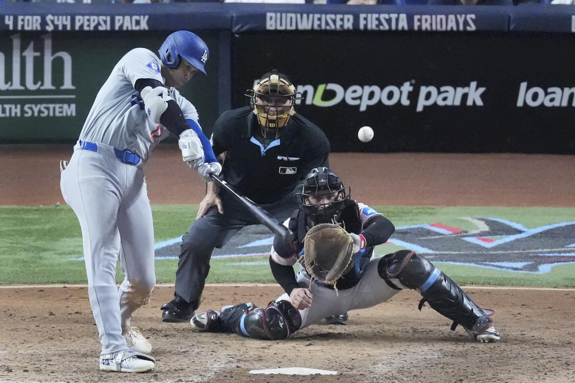 Dodgers star Shohei Ohtani hits his 50th home run of the season in the seventh inning of a 20-4 win.