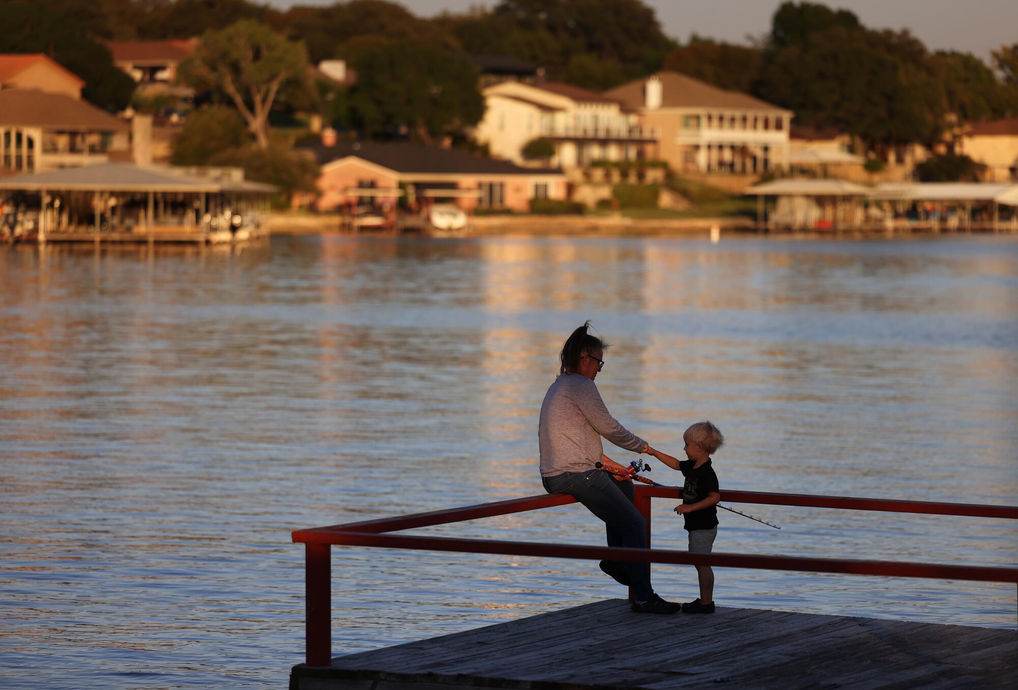 Glenda Gillingham fishes with her grandson Liam, 3, in Granbury, Texas, on Sept. 9.