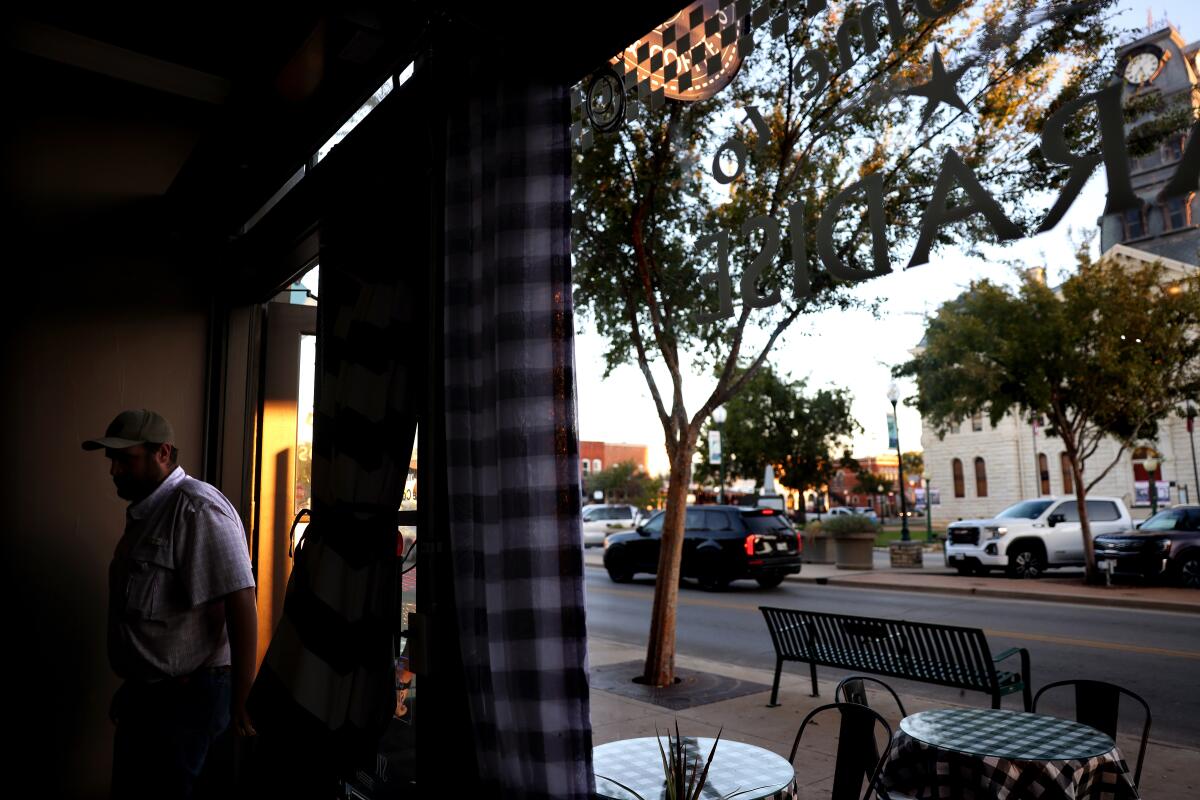 A customer enters Paradise Bistro & Coffee Co. in the Historic Granbury Square in Granbury, T