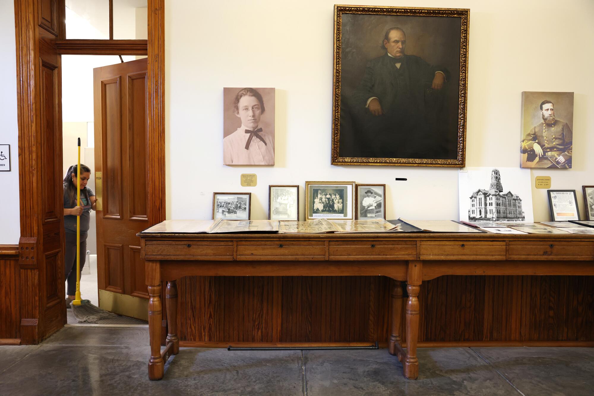 Historical photographs are displayed inside the Hood County Courthouse in Granbury, Texas including N