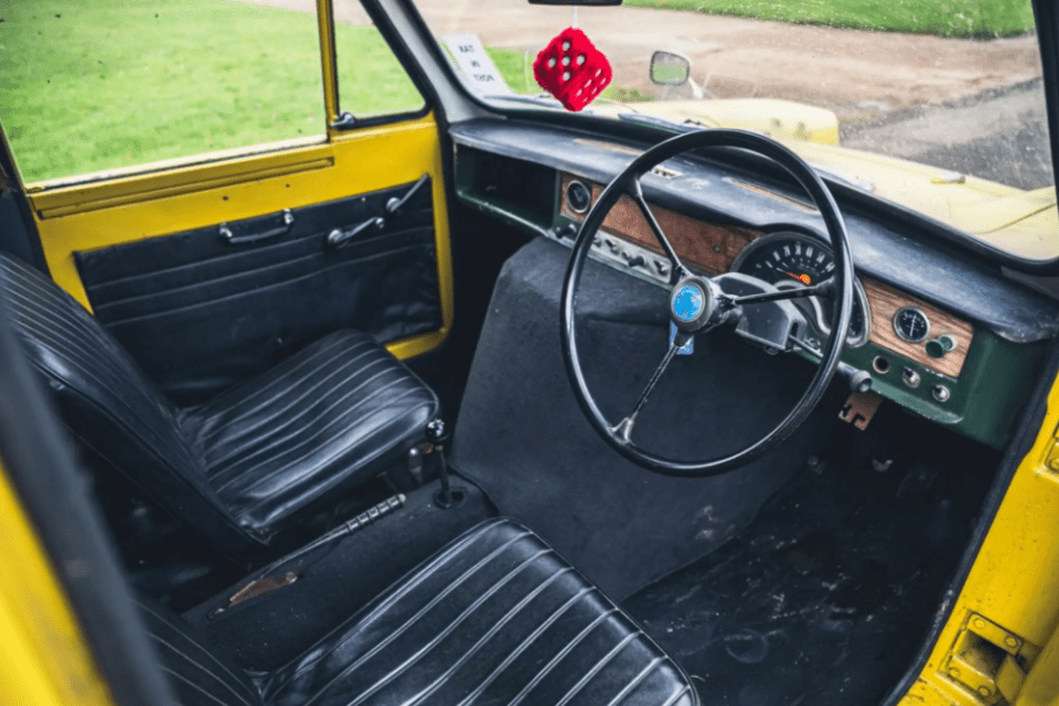 Pictured: The vehicle's interior, complete with fuzzy dice