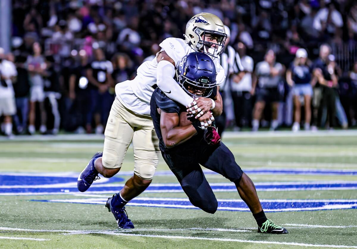 Isala Wiley-Ava tackles another player.