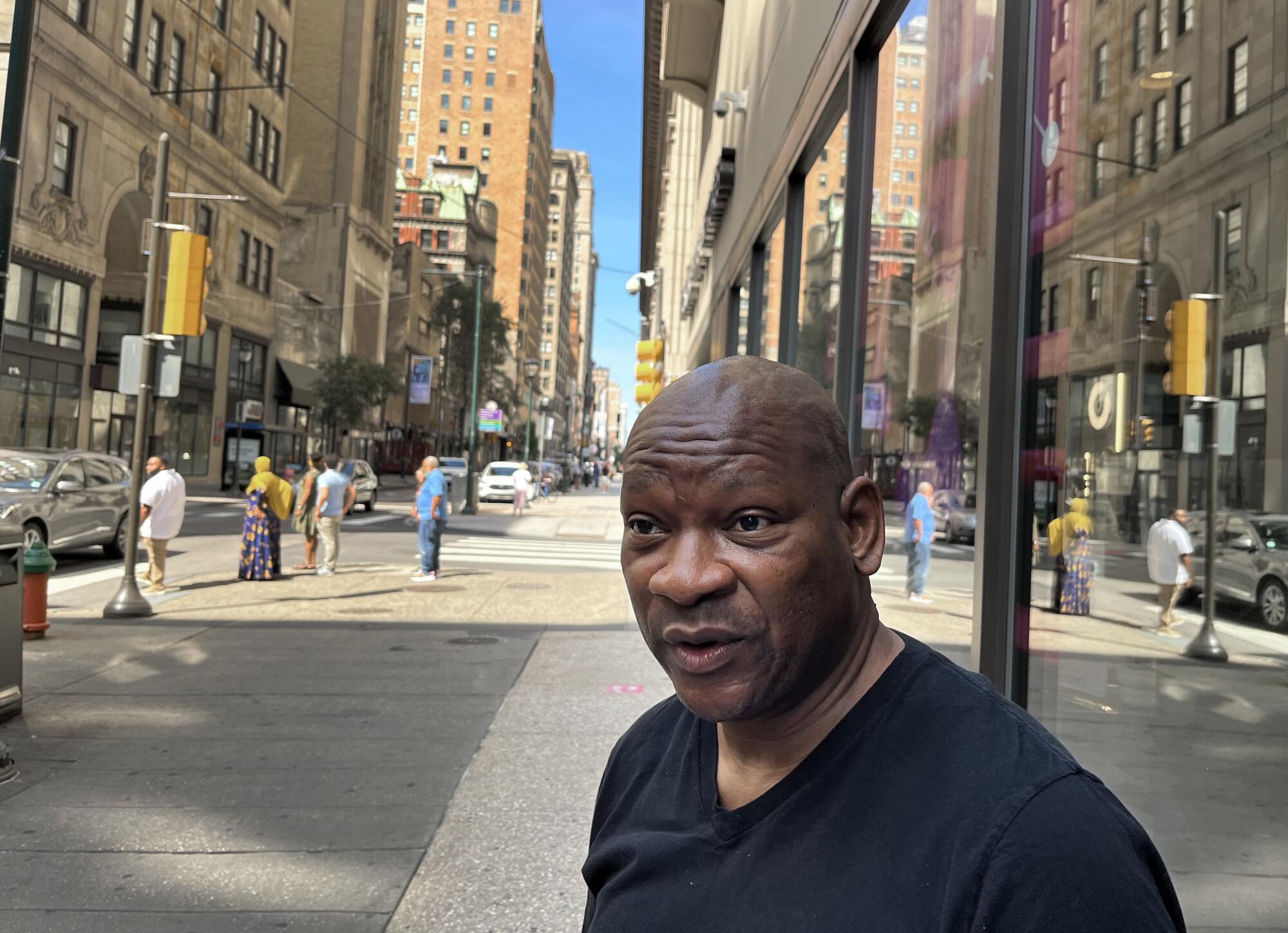 Ivan Turnipseed speaking on a sidewalk in Philadelphia