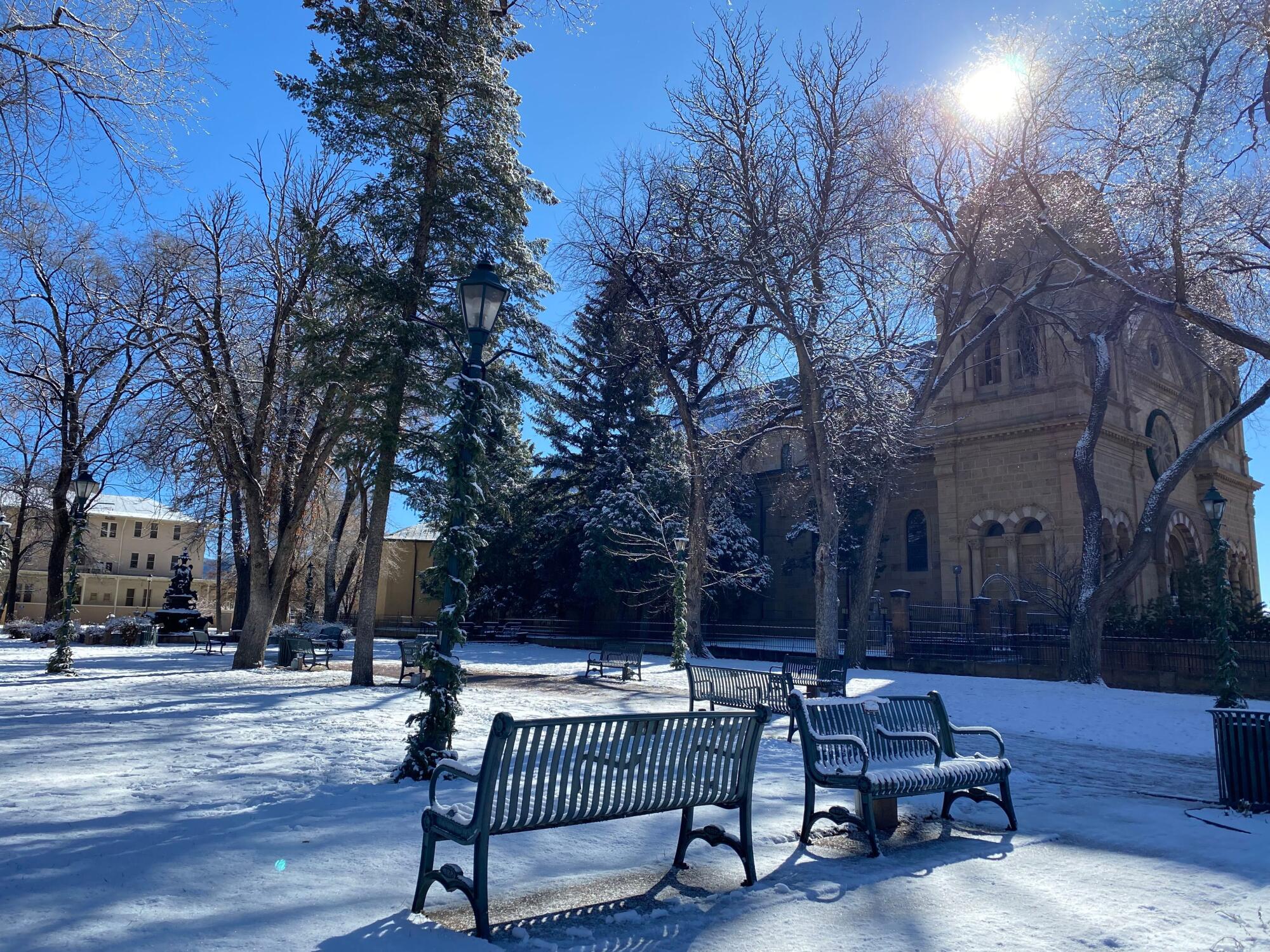 Snow blankets the Santa Fe Plaza.