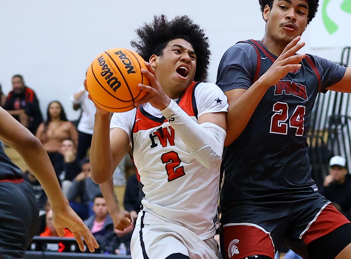 Robert Hinton of Harvard-Westlake battles with Douglas Langford of St. Pius X-St. Matthias.