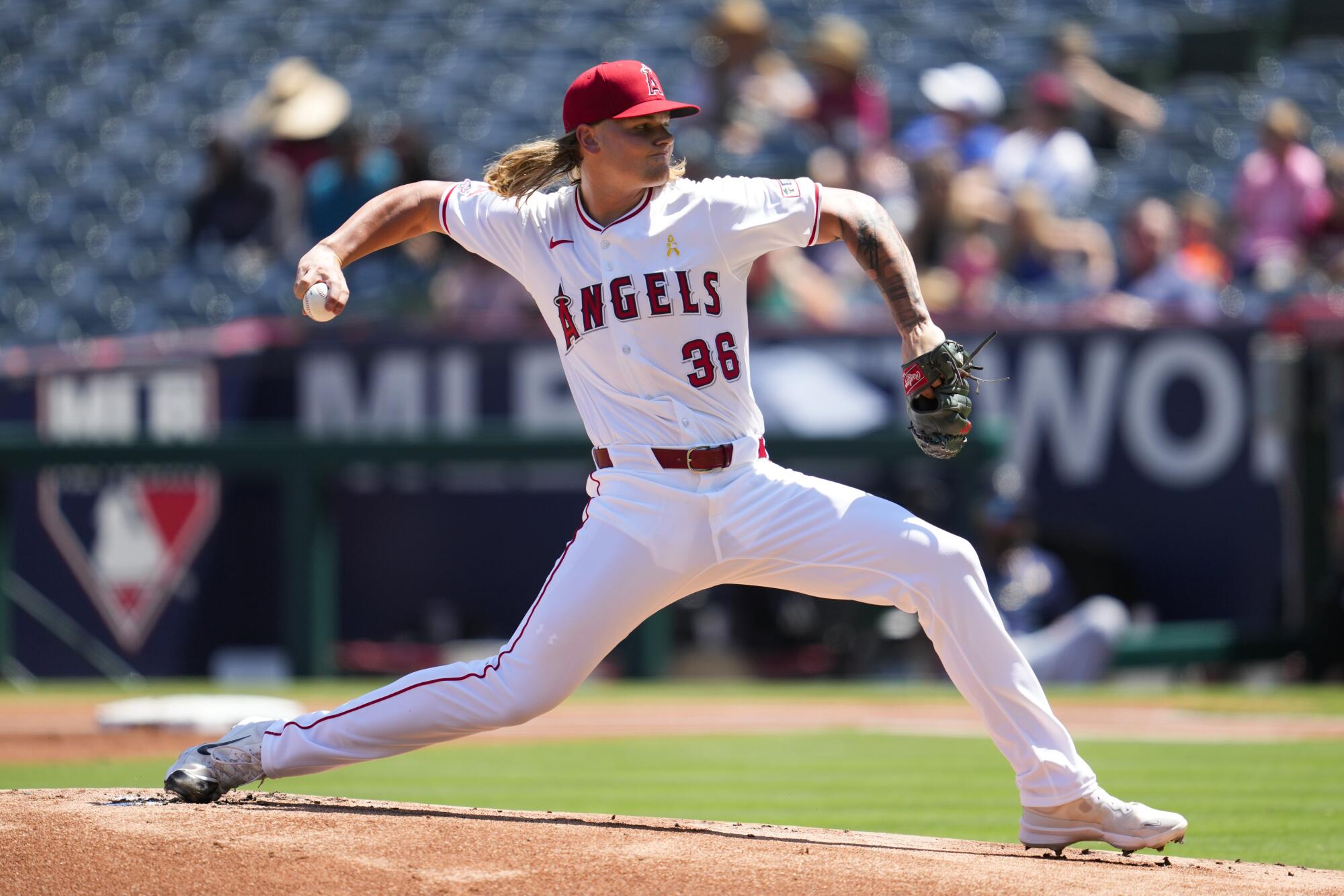 Angels starting pitcher Caden Dana throws during the first inning.