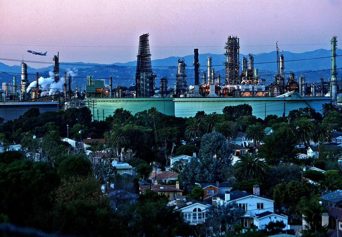 A Chevron oil refinery looms over homes in El Segundo.