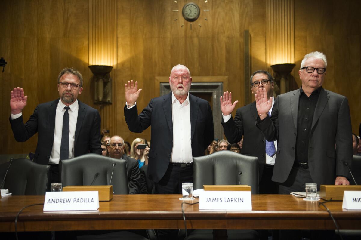 Backpage executives getting sworn in to testify at a Senate hearing in 2017