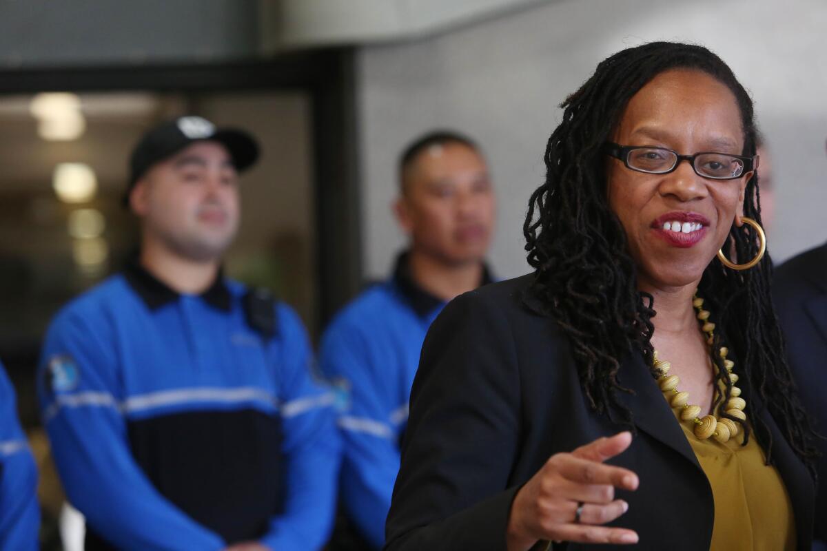 Lateefah Simon speaks at a news conference