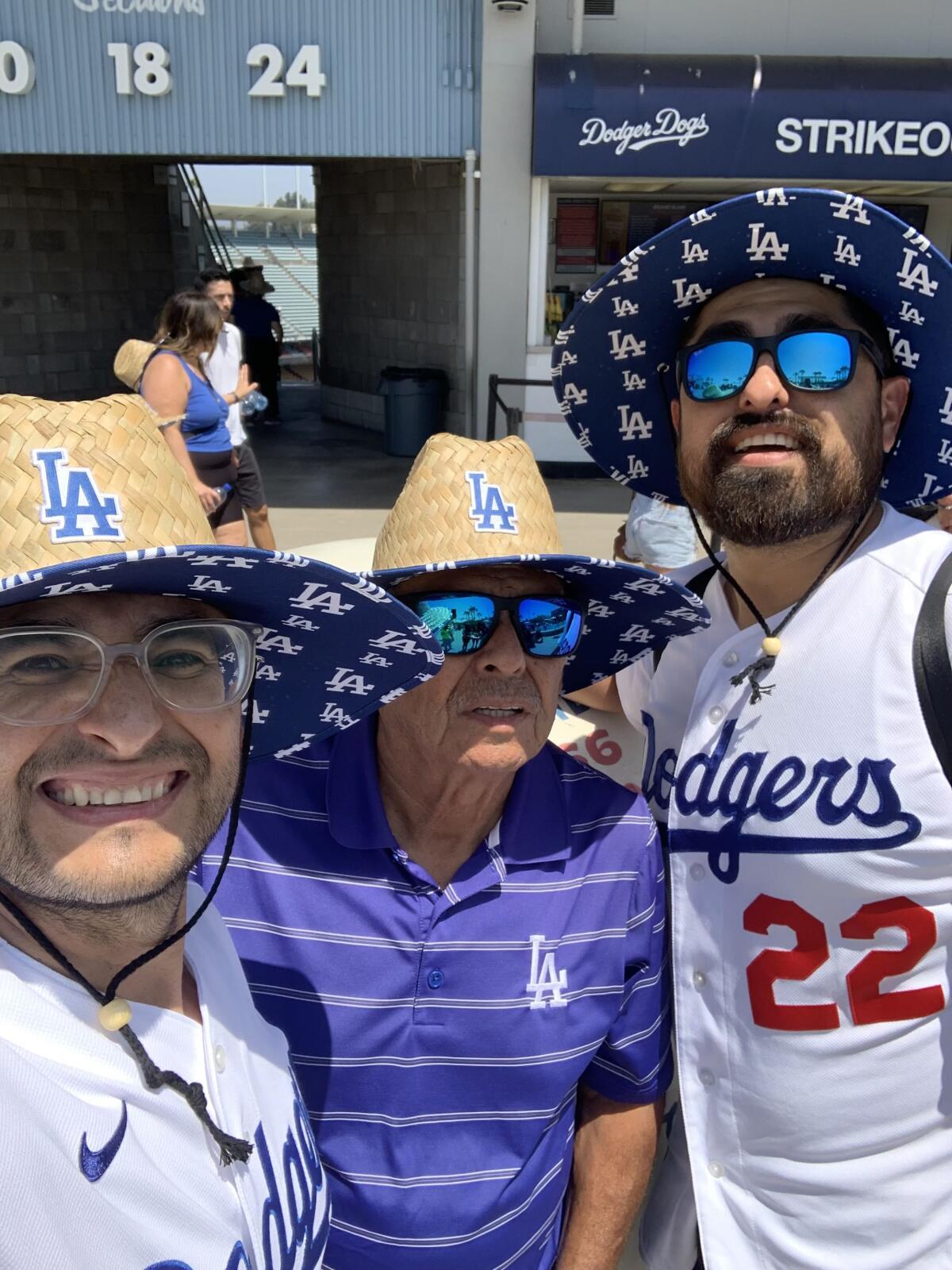 Santos Arellano, center, attends a game at Dodger Stadium with his sons Rodolfo, left, and Diego this past Father's Day.