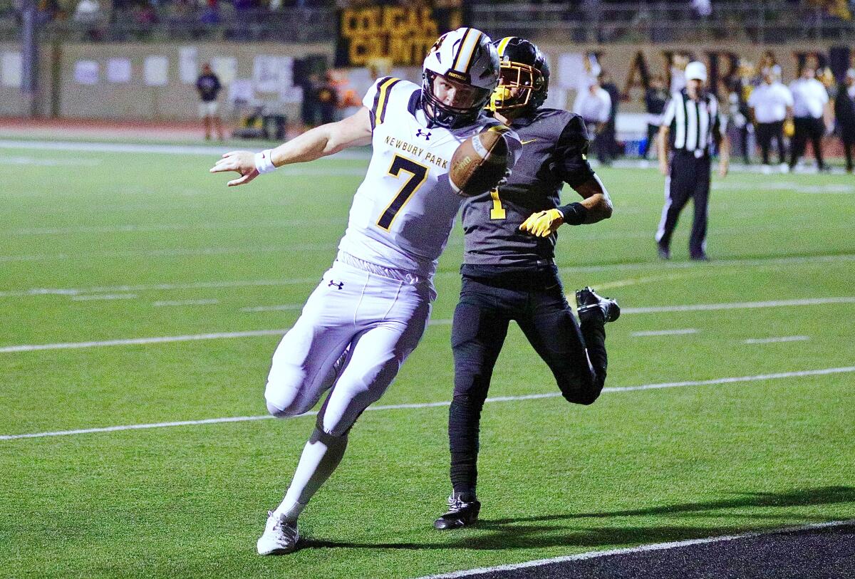 Newbury Park quarterback Brady Smigiel scores on a three-yard touchdown run during the second quarter.