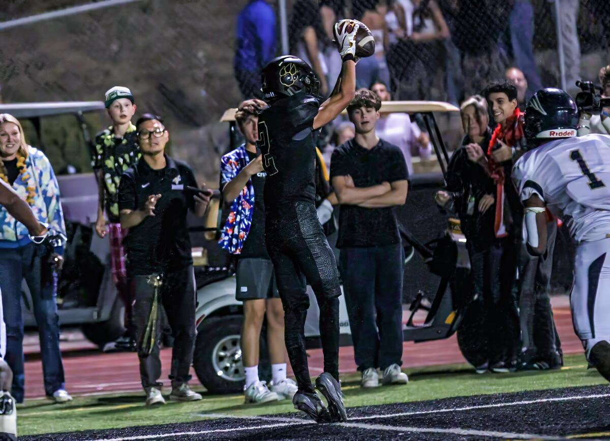 Dylan Hein of Calabasas somehow gets his feet down in bounds for the touchdown catch against Birmingham.