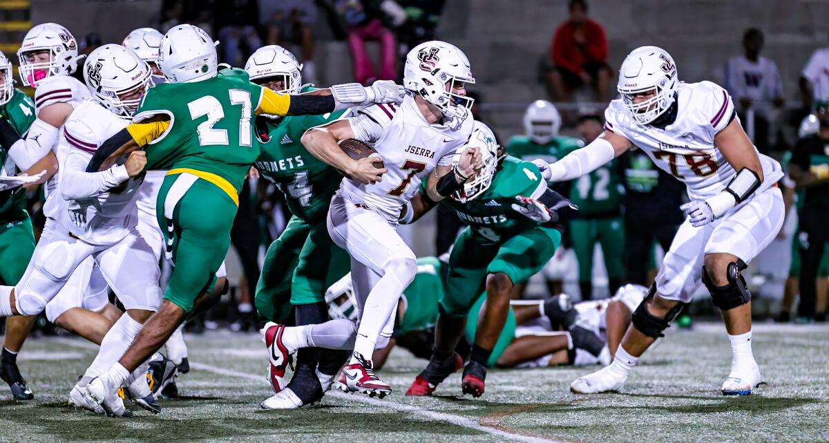 Quarterback Ryan Hopkins of JSerra runs for a touchdown against San Diego Lincoln.