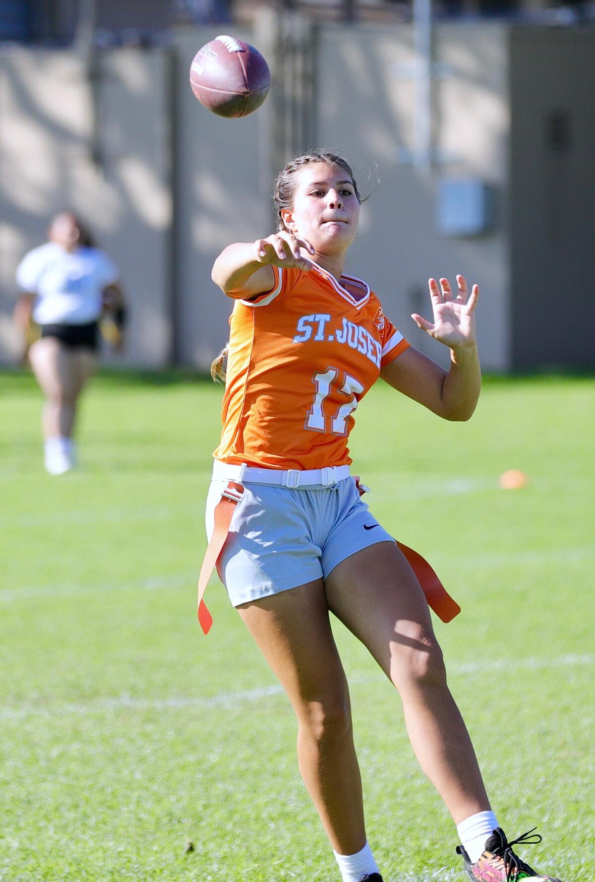 St. Joseph quarterback Lexi Loya makes a pass while on the move during a win over Ramona Convent.