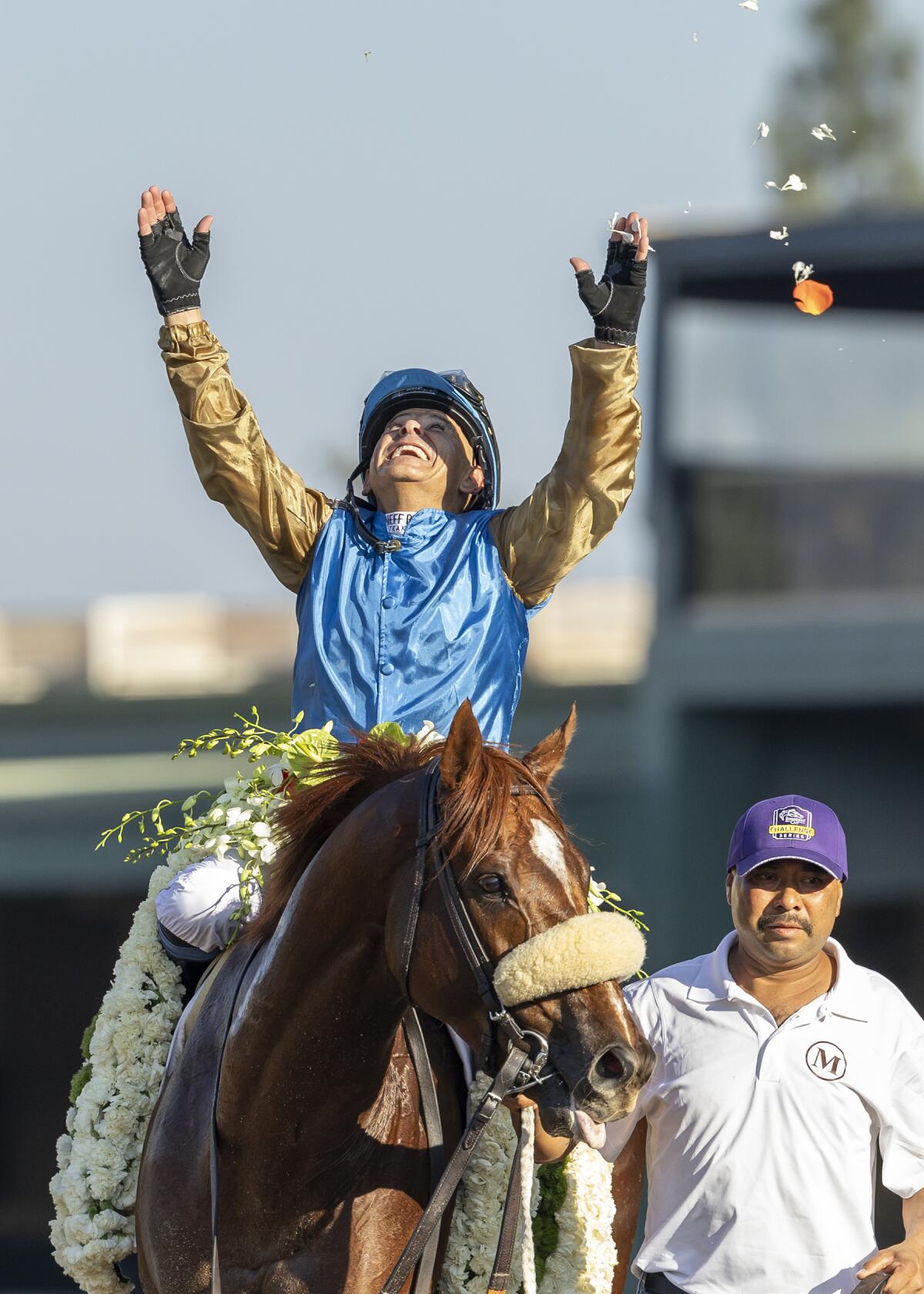 Wathnan Racing's Subsanador and jockey Mike Smith celebrate after winning the inaugural California Crown Stakes.