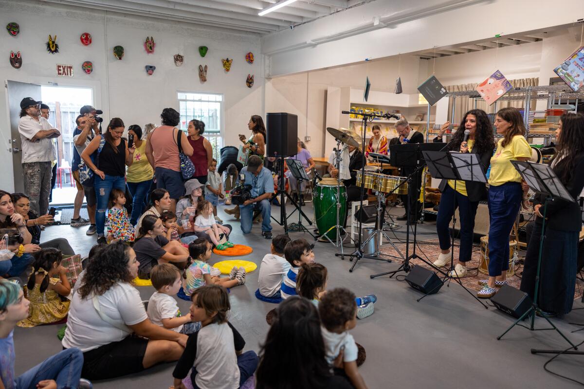 Co-founders Celene Navarrete and Chiara Arroyo thank guests at LA Librería's grand reopening.