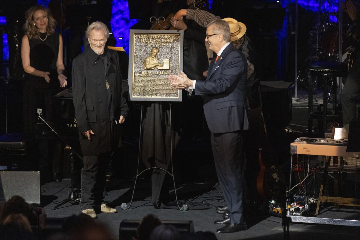 Kris Kristofferson, left, stands during the Country Music Hall of Fame Medallion Ceremony 