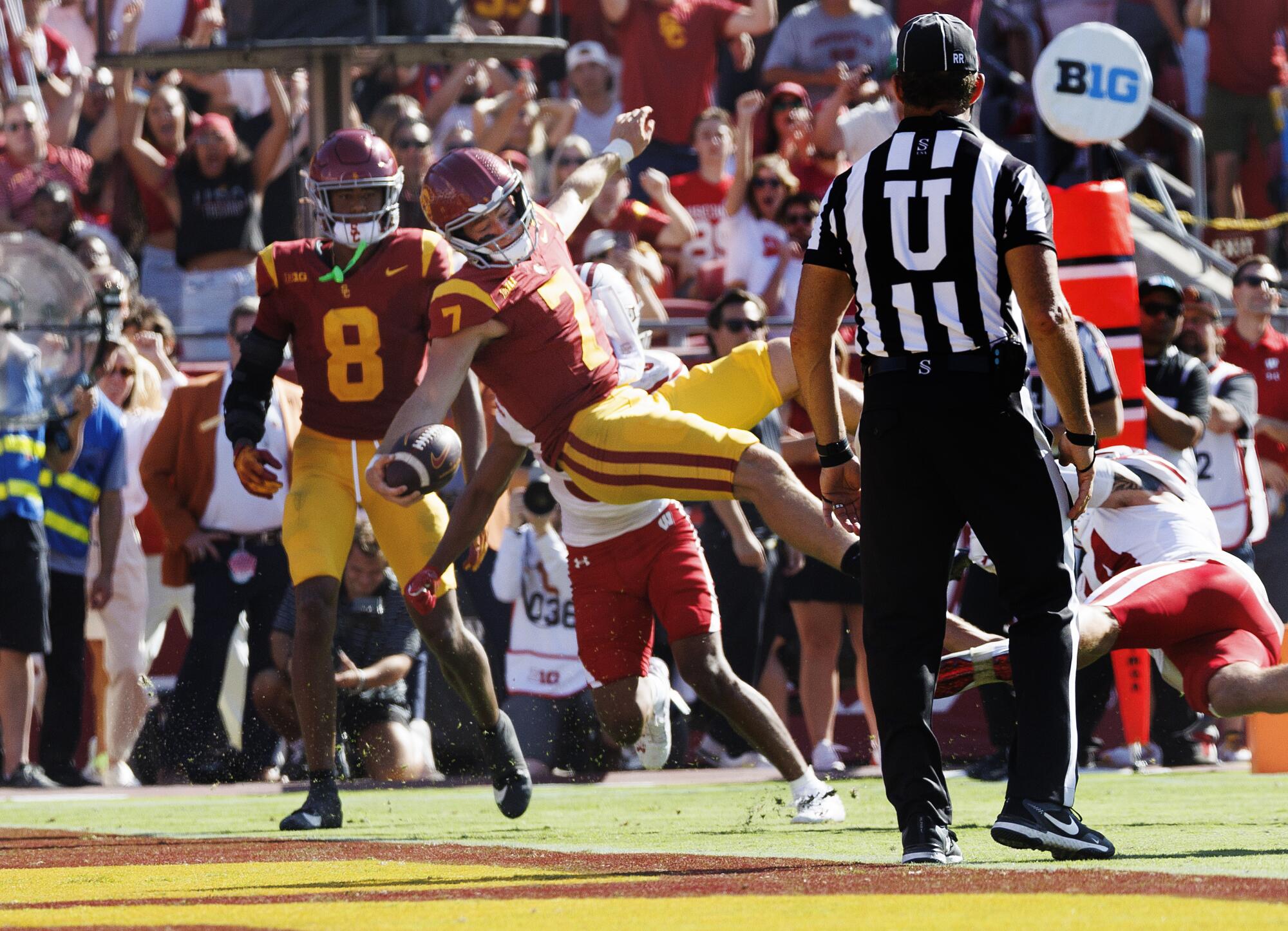 USC quarterback Miller Moss scores on a fourth-down play against Wisconsin in the fourth quarter.