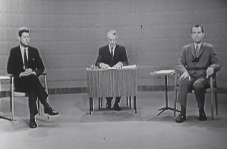 Senator John F. Kennedy and Vice President Richard Nixon sit prior to the start of the 1960 U.S. presidential election debate, in Chicago, Illinois, U.S., September 26, 1960.