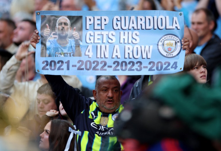 Soccer Football - Premier League - Manchester City v Ipswich Town - Etihad Stadium, Manchester, Britain - August 24, 2024 Fans display a sign in the stands before the match REUTERS/Phil Noble EDITORIAL USE ONLY. NO USE WITH UNAUTHORIZED AUDIO, VIDEO, DATA, FIXTURE LISTS, CLUB/LEAGUE LOGOS OR 'LIVE' SERVICES. ONLINE IN-MATCH USE LIMITED TO 120 IMAGES, NO VIDEO EMULATION. NO USE IN BETTING, GAMES OR SINGLE CLUB/LEAGUE/PLAYER PUBLICATIONS. PLEASE CONTACT YOUR ACCOUNT REPRESENTATIVE FOR FURTHER DETAILS..