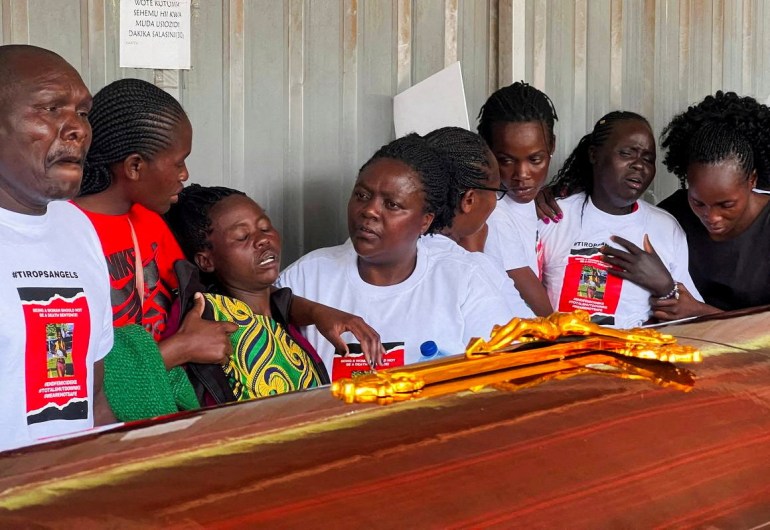 Family members mourn and react next to the coffin of the slain Olympian Rebecca Cheptegei, who died after her former boyfriend doused her in petrol and set her ablaze, at the Moi Teaching & Referral Hospital (MTRH) funeral home, in Eldoret, Kenya September 13, 2024. REUTERS/Edwin Waita