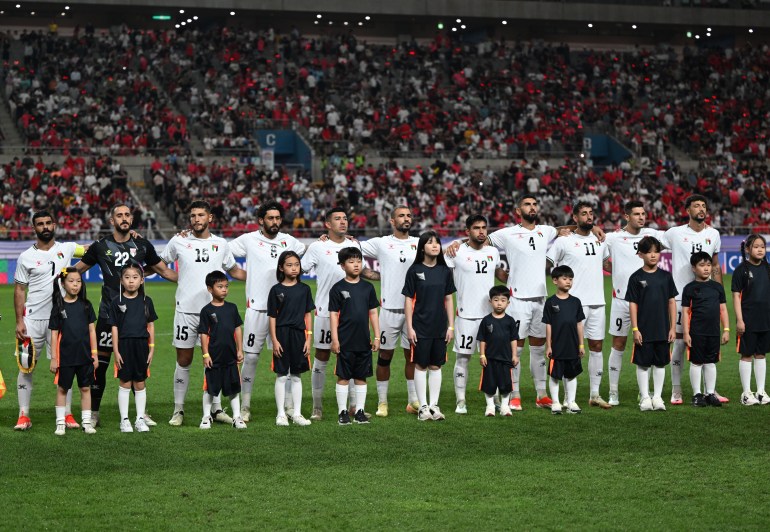 Palestine's players line up for the anthems during the FIFA World Cup 2026 Asia zone qualifiers football match between South Korea and Palestine in Seoul on September 5, 2024. (Photo by Jung Yeon-je / AFP)