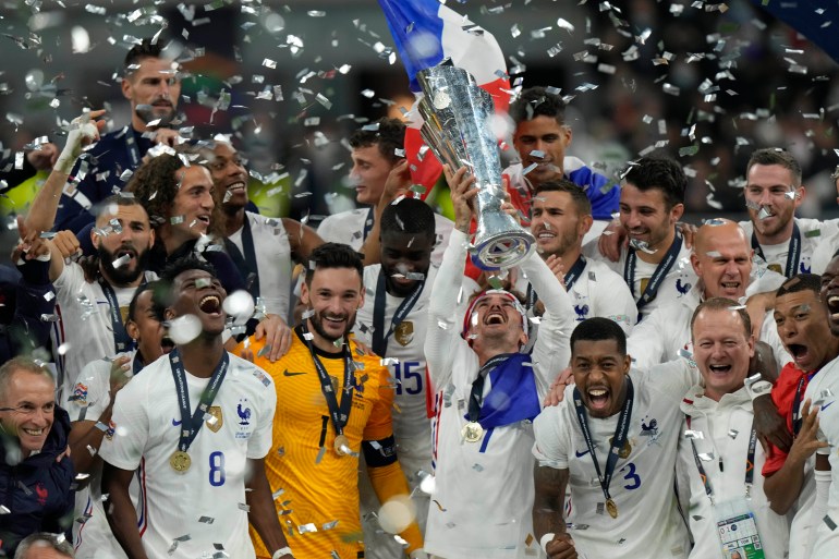 France's players celebrate their victory at the end of the UEFA Nations League final soccer match between France and Spain at the San Siro stadium, in Milan, Italy, Sunday, Oct. 10, 2021. (AP Photo/Luca Bruno)