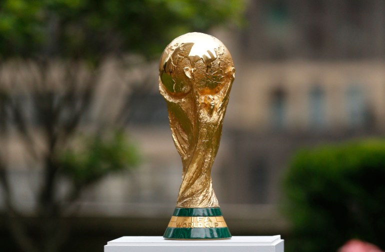 2026 FIFA World Cup Trophy on display before press conference at Rockefeller Plaza. Thursday, June 16, 2022, in New York. (AP Photo/Noah K. Murray)