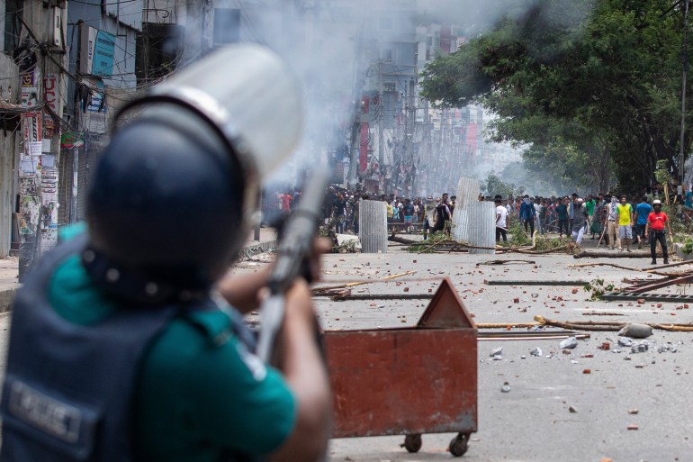 Police fire tear gas shells to disperse students protesting over the quota system in public service, in Dhaka, Bangladesh, Friday, July 19, 2024. (AP Photo/Rajib Dhar)