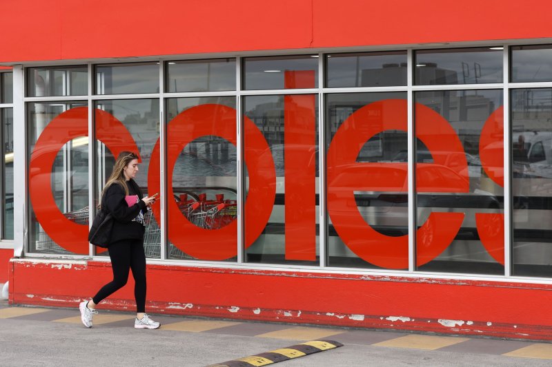 A person walks outside a Coles supermarket in Melbourne, Australia, on September 23. Australia's consumer watchdog has launched legal action against Woolworths and Coles for allegedly misleading buyers with fake discounts. Photo by Con Chronis/EPA-EFE