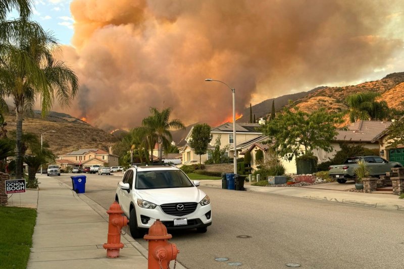 The Line fire is threatening homes in San Bernardino, Calif., as evidenced in a photo that was taken Sunday afternoon. Photo courtesy San Bernardino Valley Water Conservation District