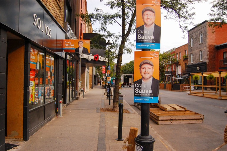 NDP candidate posters on Wellington Street in Montreal, Canada, ahead of a byelection