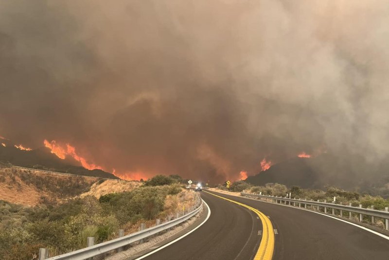 The Line Fire was raging at SR-330 above the fire station in San Bernardino County. The highway was closed in both directions. Photo by Cal Fire/Facebook