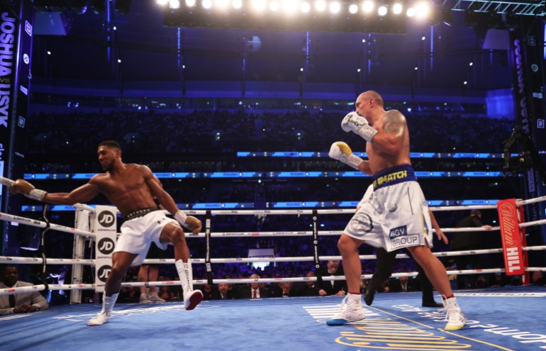 LONDON, ENGLAND - SEPTEMBER 25: Oleksandr Usyk looks on as Anthony Joshua reacts during the Heavyweight Title Fight between Anthony Joshua and Oleksandr Usyk at Tottenham Hotspur Stadium on September 25, 2021 in London, England. (Photo by Julian Finney/Getty Images)