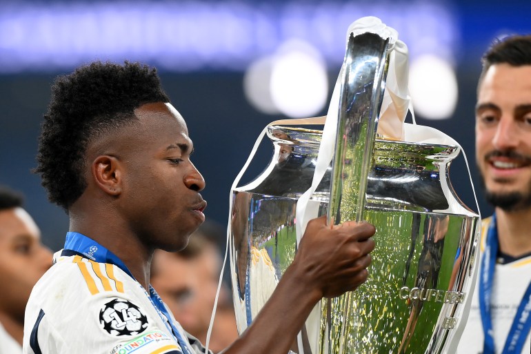 LONDON, ENGLAND - JUNE 01: Vinicius Junior of Real Madrid kisses the UEFA Champions League Trophy after his team's victory during the UEFA Champions League 2023/24 Final match between Borussia Dortmund and Real Madrid CF at Wembley Stadium on June 01, 2024 in London, England. (Photo by Justin Setterfield/Getty Images)