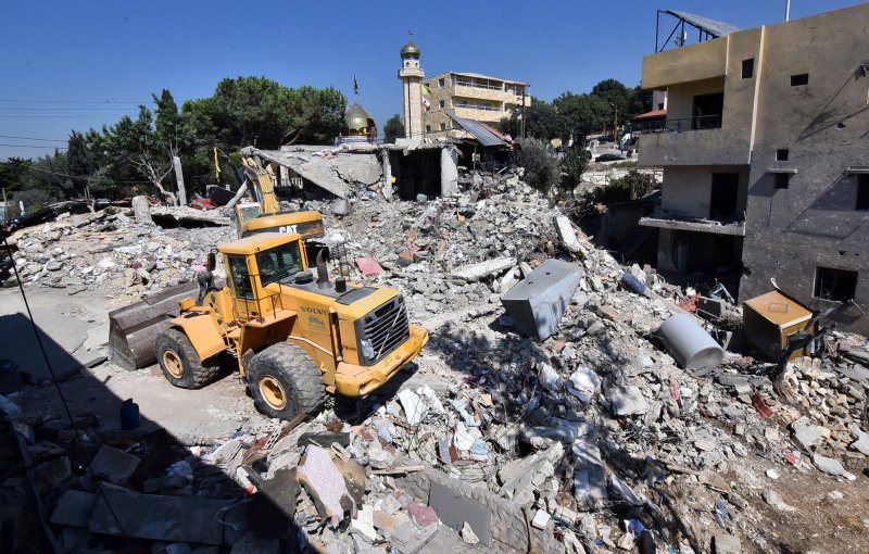 Bulldozer working amidst destruction following the Israeli bombardment of the building the previous day, on September 27, 2024, in Tyre, Lebanon. On Monday, Hamas said its leader in the country was killed in an Israeli airstrike. Photo by Fadel Itani/UPI